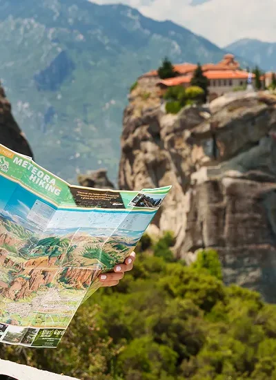 Beautiful tourist greece with meteora monasteries background 400x550